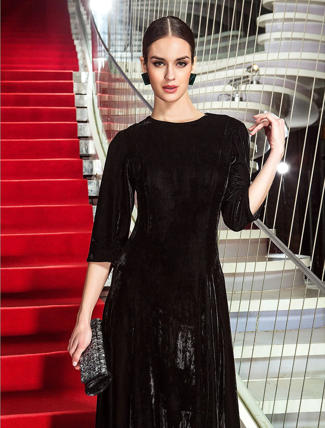 Another full-length shot of the A-line velvet dress, emphasizing its formal style.
