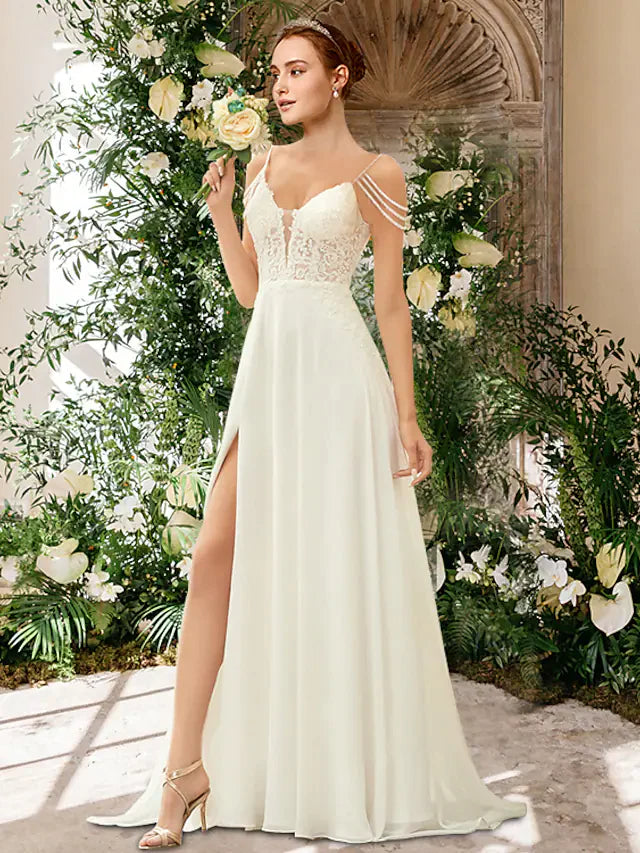 Model in A-Line wedding dress with sweetheart neckline, spaghetti straps, and split front.