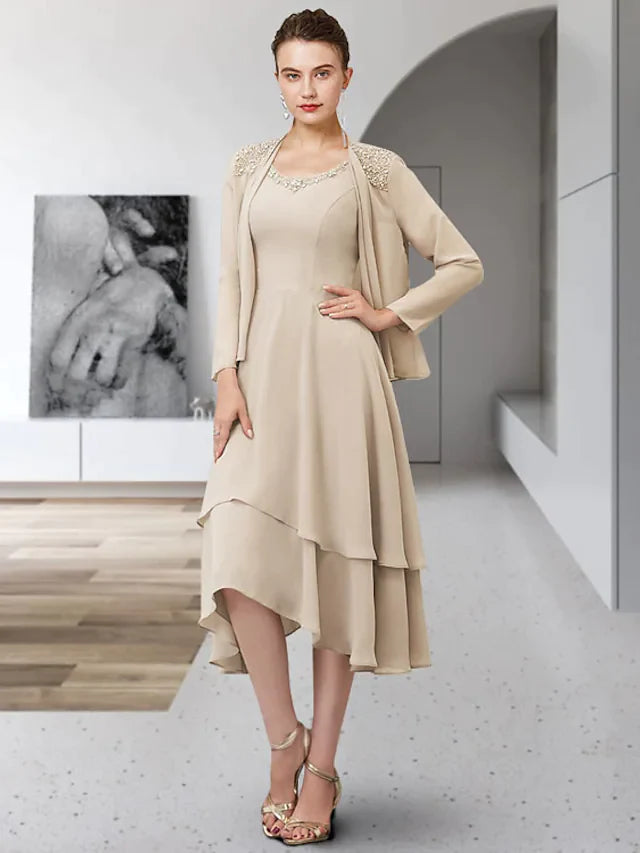 Front view of an elegant two-piece A-line mother of the bride dress with jewel neck and ruffles.