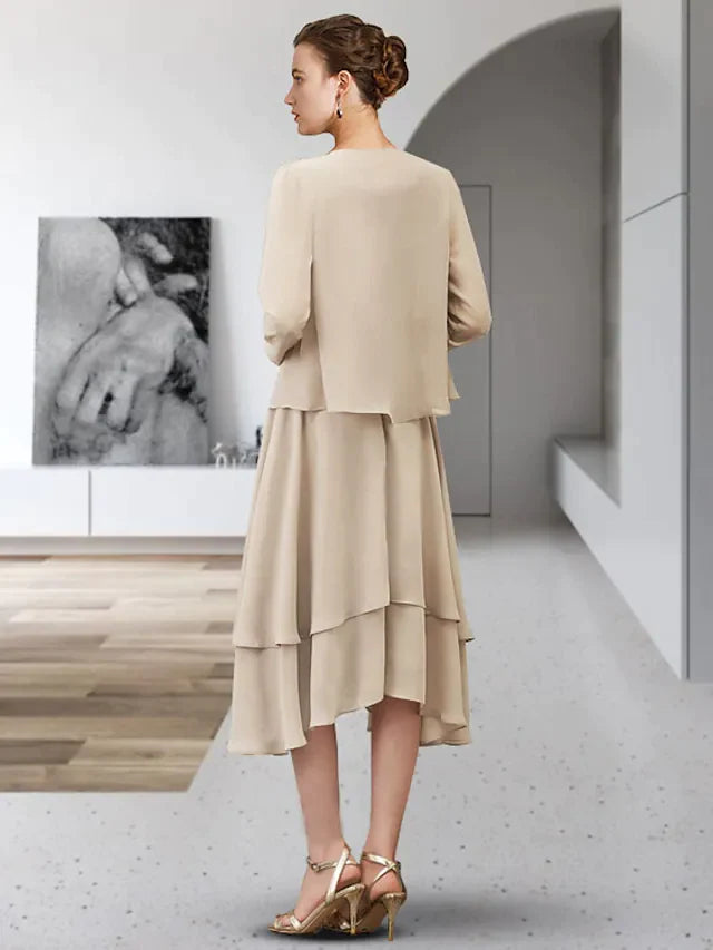 Side view of the two-piece A-line mother of the bride dress, showing asymmetrical design and tier appliques.