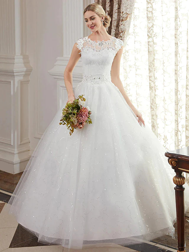 Elegant ball gown wedding dress with jewel neck and cap sleeves.