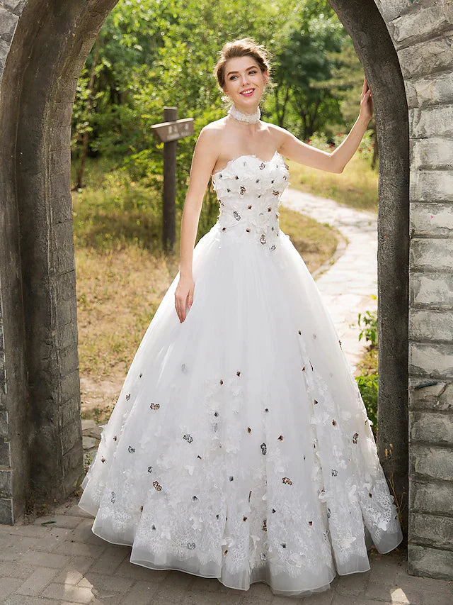 Full length view of the bride wearing the ball gown wedding dress.