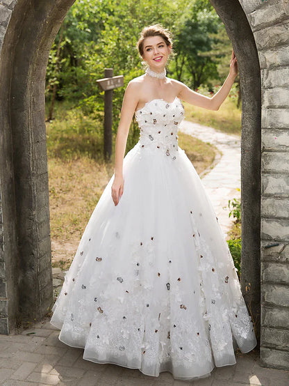 Full length view of the bride wearing the ball gown wedding dress.