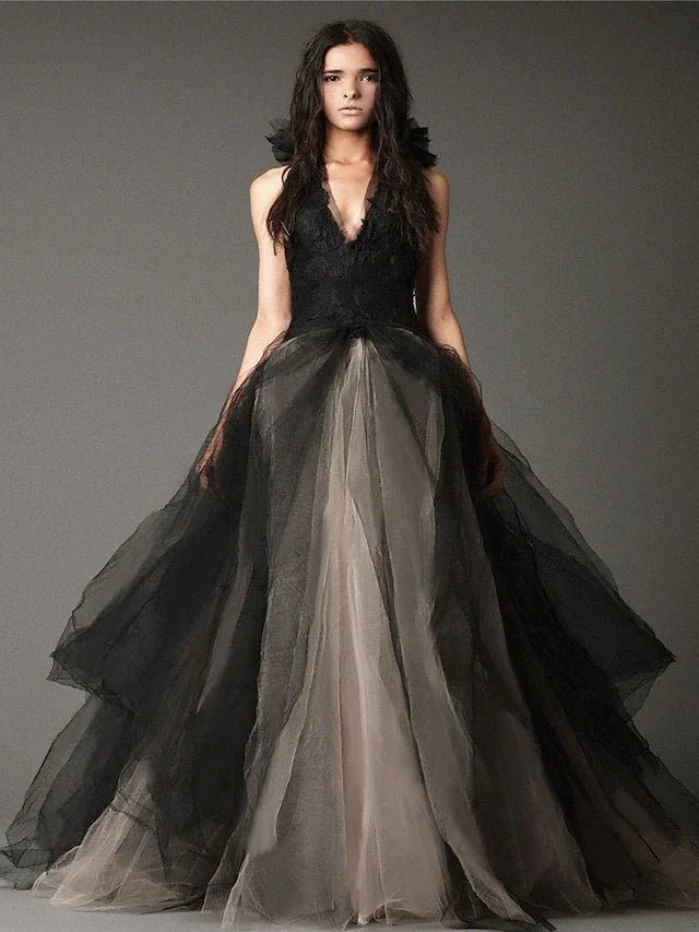 Elegant black halter neck ball gown wedding dress with intricate appliques and floor-length satin tulle skirt.