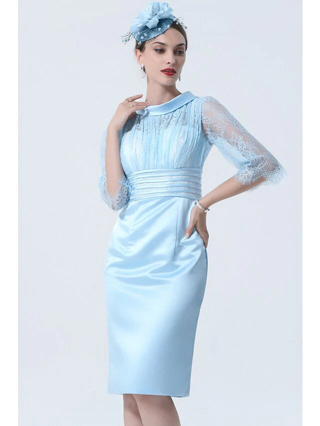 Back view of the knee-length Mother of the Bride dress, showcasing the half sleeves and charmeuse fabric.
