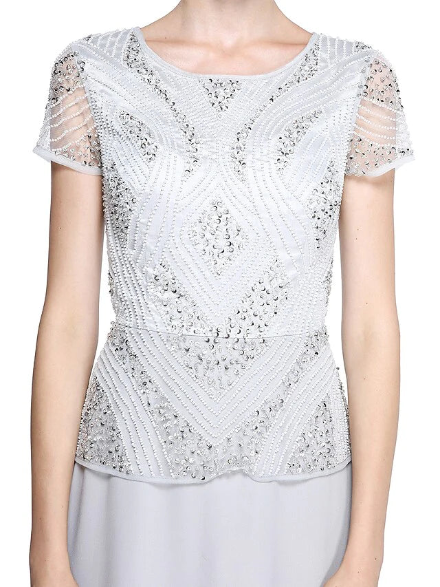 Detail of the delicate beading and sequins on the short sleeve of the mother of the bride dress.