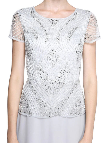 Detail of the delicate beading and sequins on the short sleeve of the mother of the bride dress.