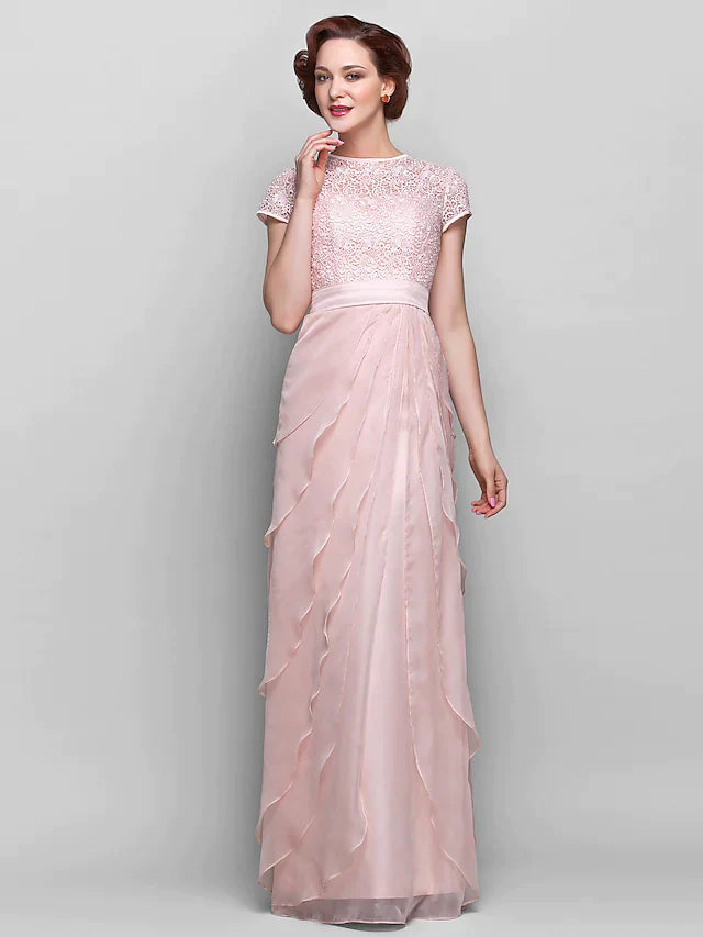 Model wearing an elegant floor-length chiffon and lace Mother of the Bride dress with a jewel neck and short sleeves.