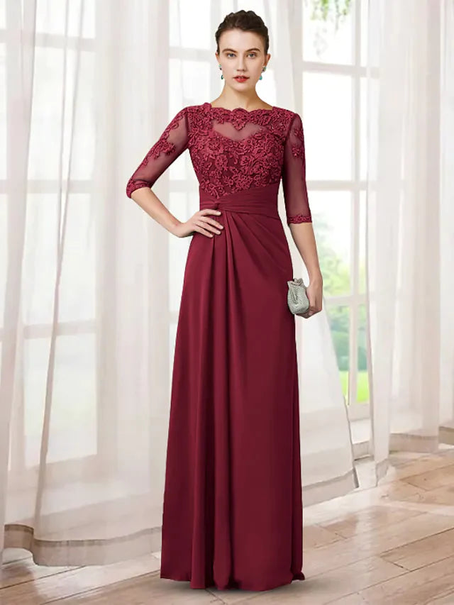 Elegant Mother of the Bride dress in chiffon and lace with jewel neck and half sleeves.
