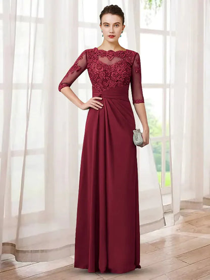Elegant Mother of the Bride dress in chiffon and lace with jewel neck and half sleeves.