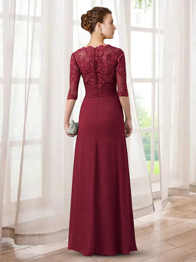 Close-up of lace appliques and ruching on the bodice of an elegant Mother of the Bride dress.
