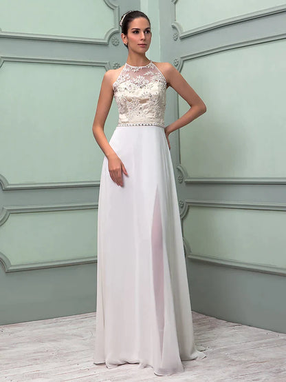 Close-up of the jewel neck and beaded sash details on the white chiffon lace wedding dress.