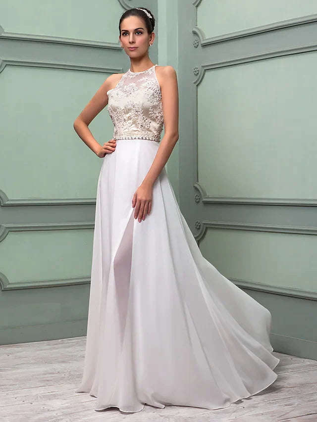 Woman posing in the white chiffon lace wedding dress, showcasing the full length and elegant silhouette.