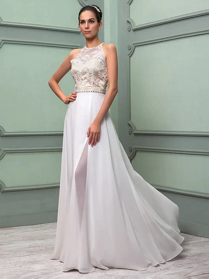 Woman posing in the white chiffon lace wedding dress, showcasing the full length and elegant silhouette.