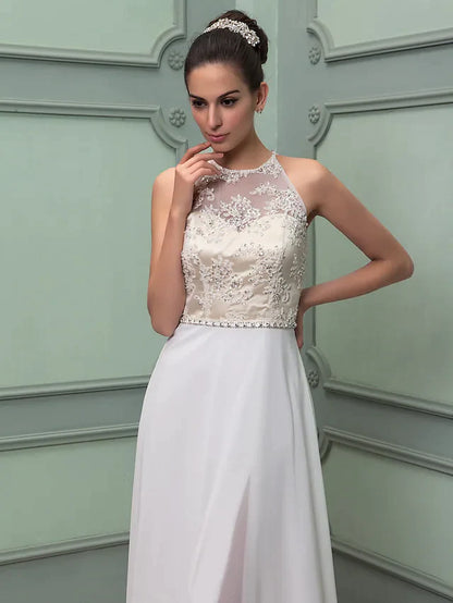 Detailed view of the lace fabric and beading on the sash of the wedding dress.
