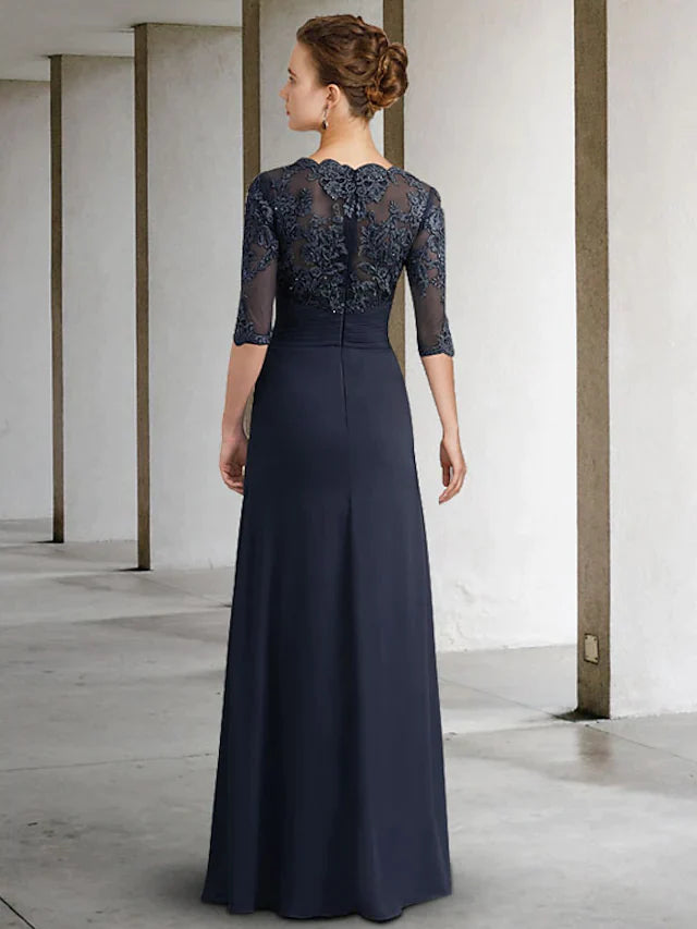 Floor-length chiffon lace gown with pleats and appliques, side view.