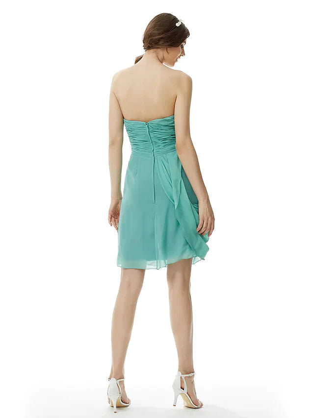 Back view of the light pink strapless chiffon bridesmaid dress, showing criss-cross detail.