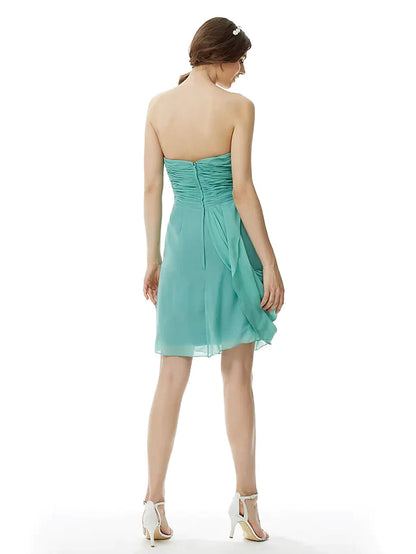 Back view of the light pink strapless chiffon bridesmaid dress, showing criss-cross detail.