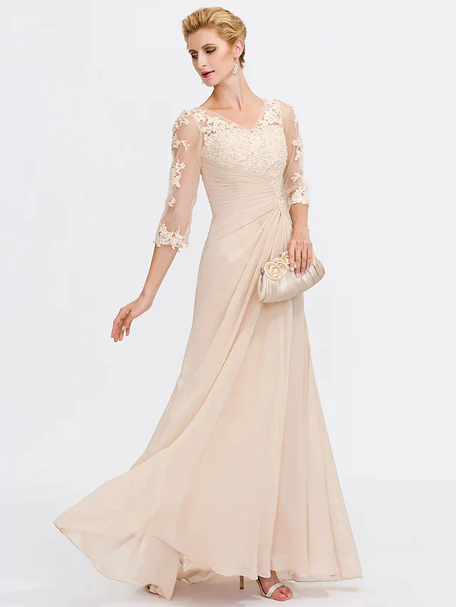 Model wearing an elegant dark blue Mother of the Bride dress with V-neck and sheer lace half sleeves.