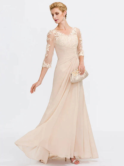 Model wearing an elegant dark blue Mother of the Bride dress with V-neck and sheer lace half sleeves.