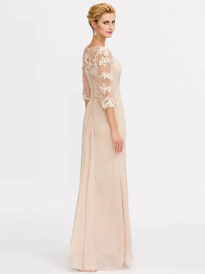 Side view of a model in a dark blue Mother of the Bride dress, showcasing side draping and lace sleeves.