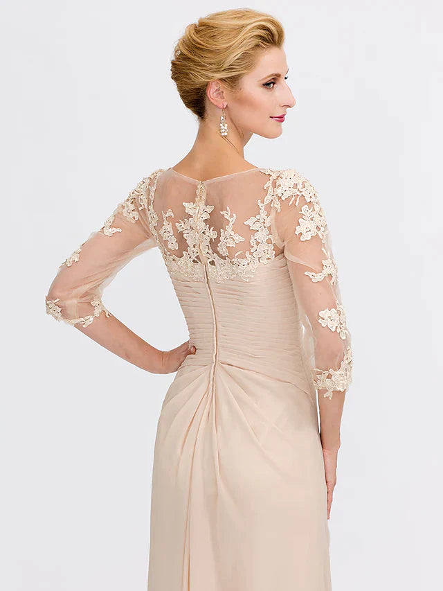 Back view of a model in a dark blue Mother of the Bride dress, highlighting the floor-length chiffon skirt.
