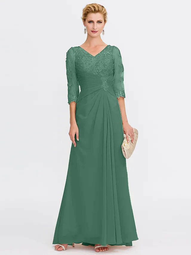 Model in a dark blue Mother of the Bride dress, showcasing the flowing chiffon fabric.