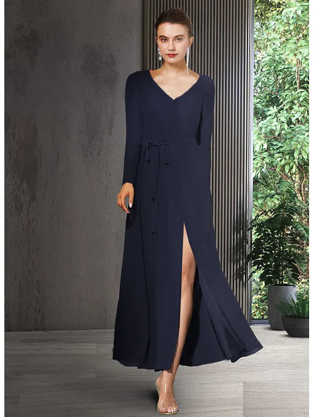 Woman wearing an elegant V-neck long sleeve chiffon Mother of the Bride dress with bow detail and split front.