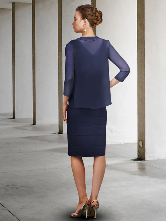 Side view of the knee-length chiffon Mother of the Bride dress with delicate appliques.