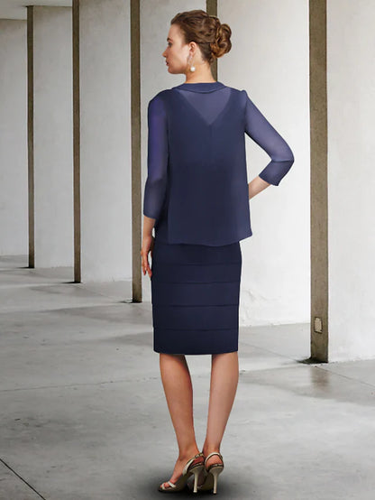 Side view of the knee-length chiffon Mother of the Bride dress with delicate appliques.