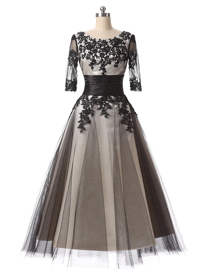 Elegant color block ball gown with lace appliques and half sleeves.