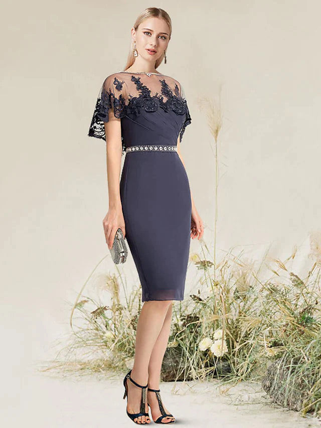 Close-up of intricate lace and applique details on the elegant dress.