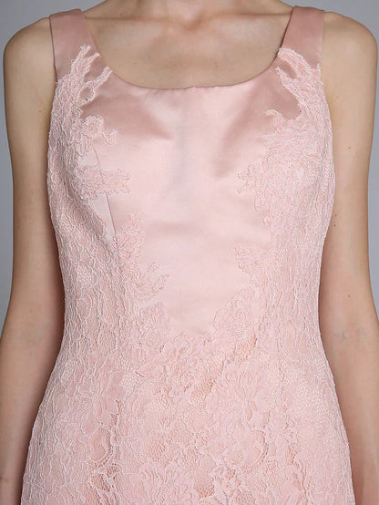Close-up of lace and satin fabric on the Mother of the Bride dress.