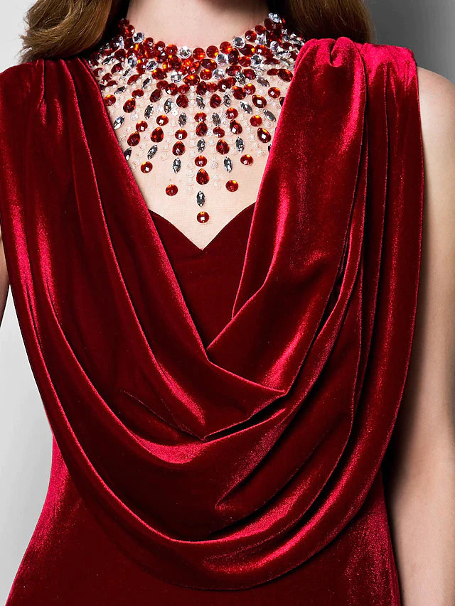 Woman posing in the velvet floor-length dress.