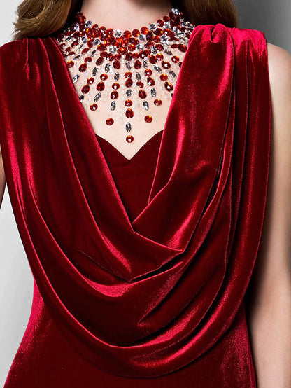 Woman posing in the velvet floor-length dress.