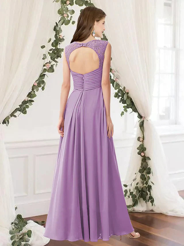 Side view of a woman in a dark blue A-line V-neck chiffon bridesmaid dress with pleats.
