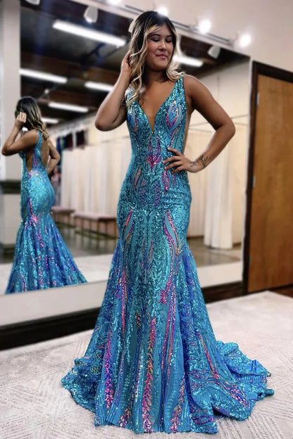 Side view of a dark red sequin mermaid prom dress, highlighting the fitted silhouette.