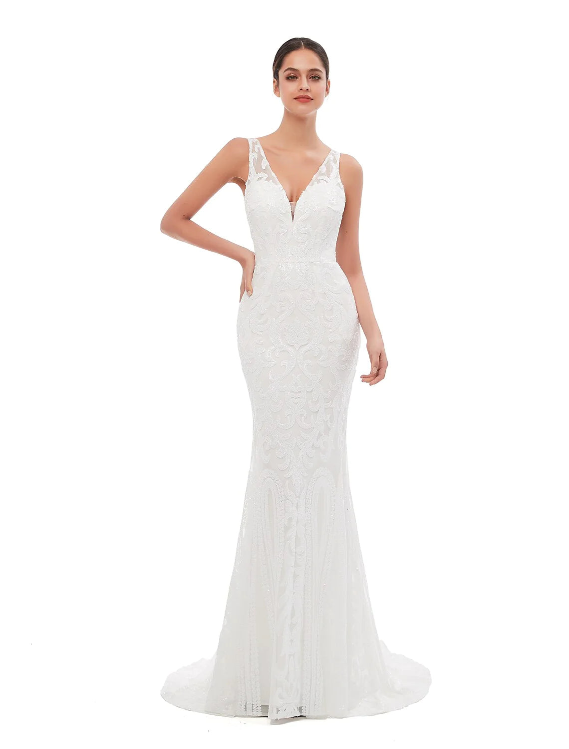 Woman in a shimmering sequin mermaid trumpet evening gown with a V-neck and court train.
