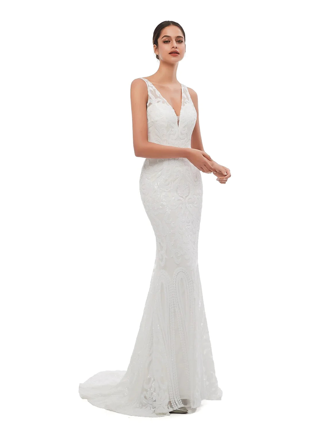 Woman posing gracefully in the elegant sequined mermaid trumpet dress for a formal event.