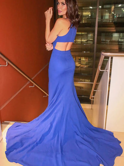 Close-up of the blue elastic woven satin fabric and ruffles on the halter prom dress.