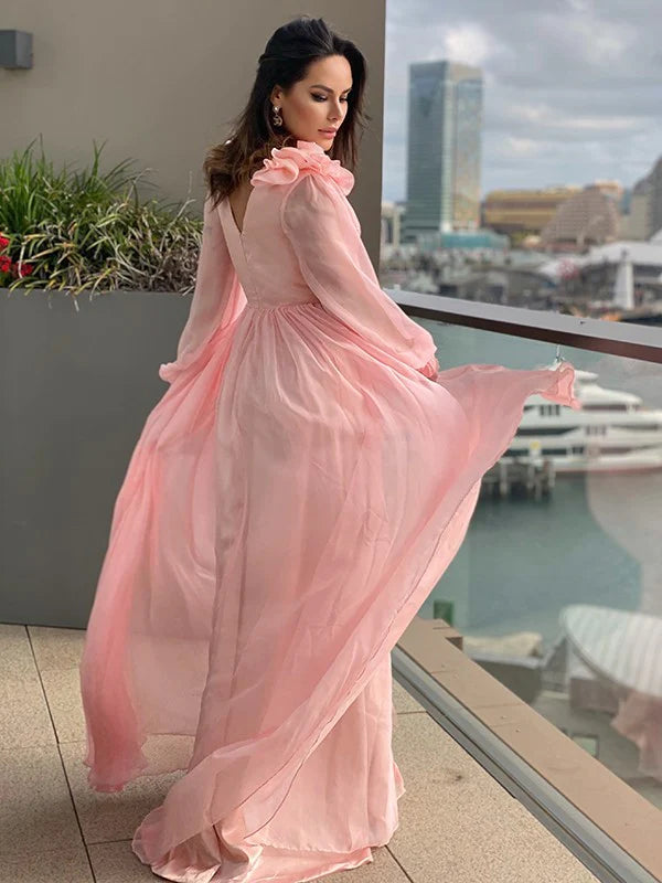 Side view of the flowy A-line prom dress with delicate ruffles.