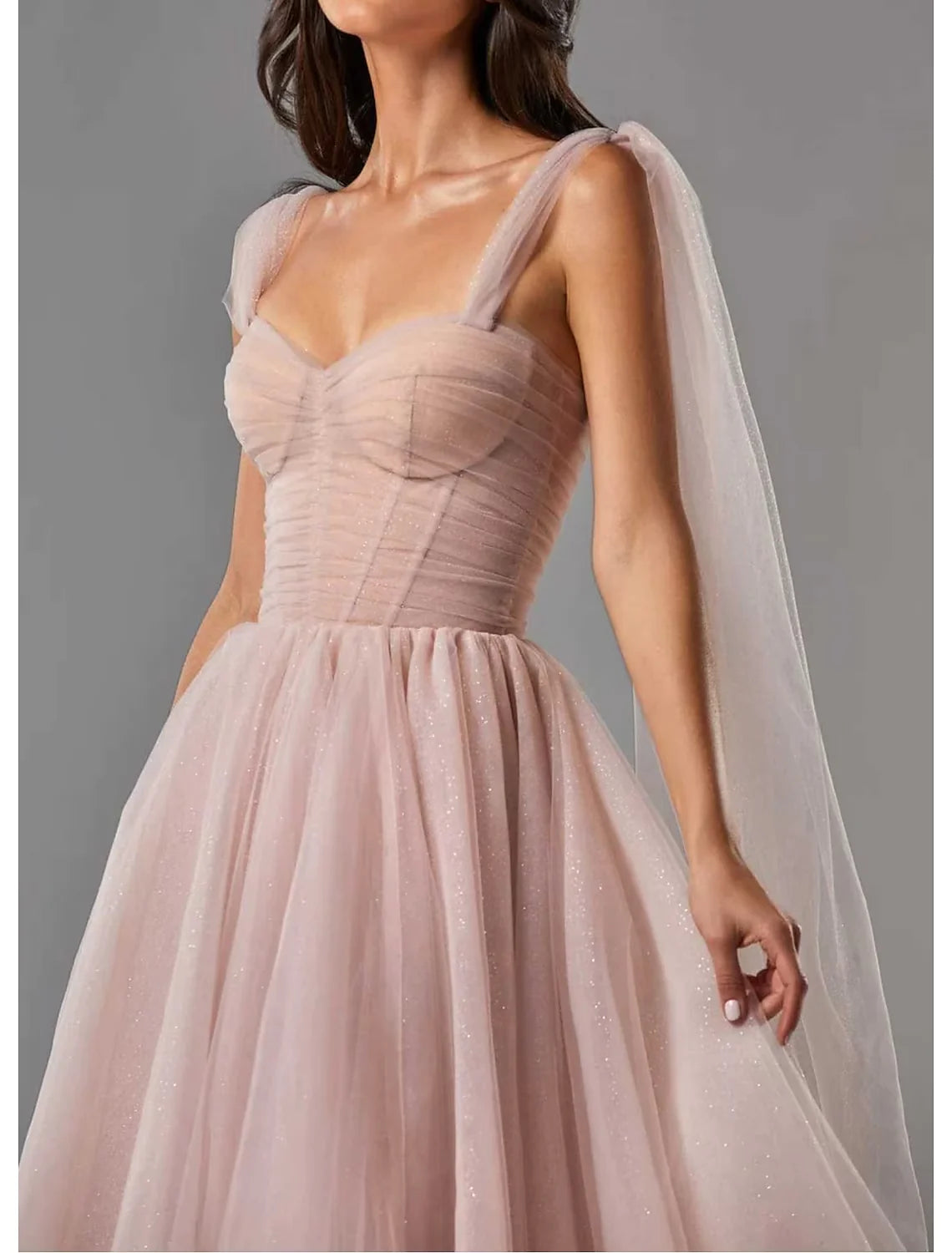 Close-up of the shimmering glitter tulle fabric on the ball gown.
