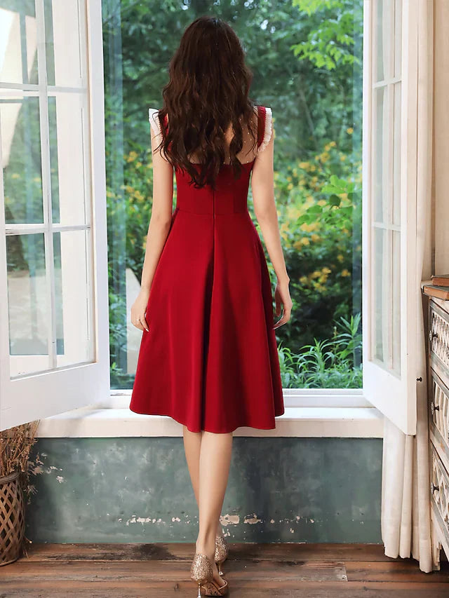 Woman in a high neck sequin dress, highlighting the knee-length silhouette.