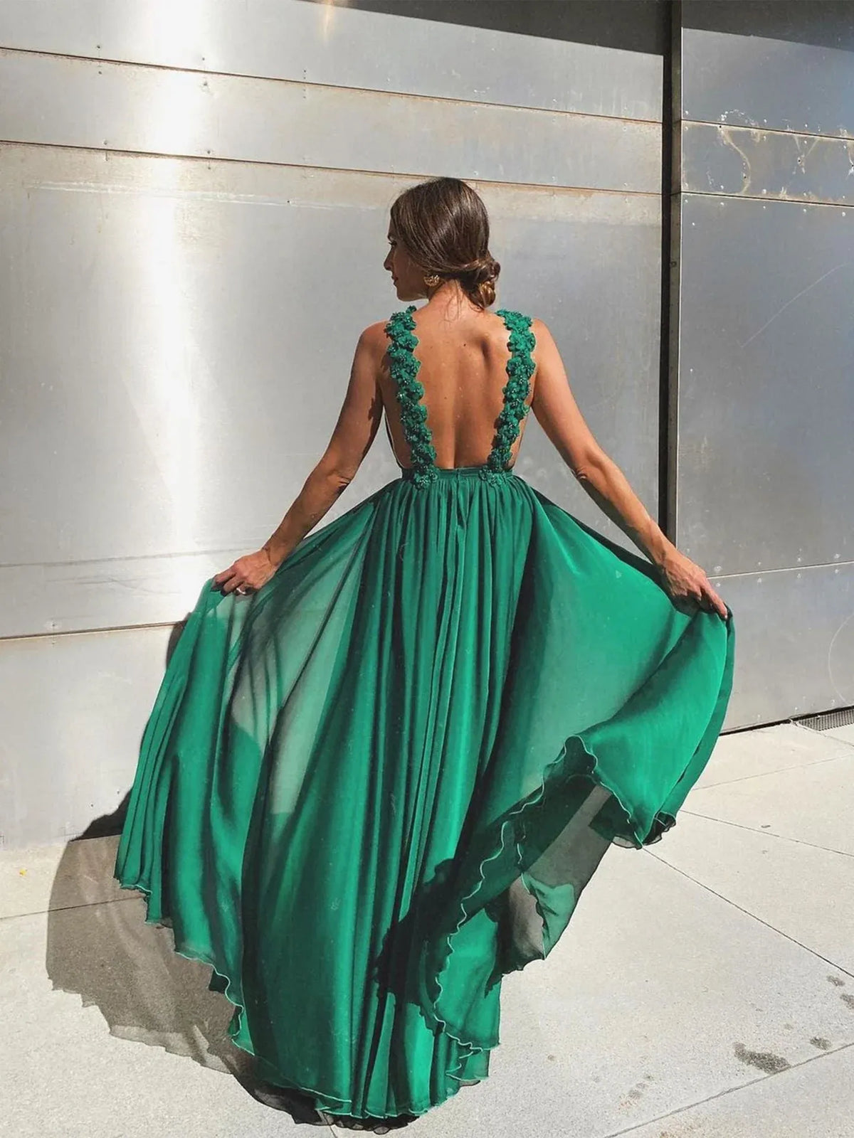 Full view of an elegant green A-line prom dress featuring a halter neckline.