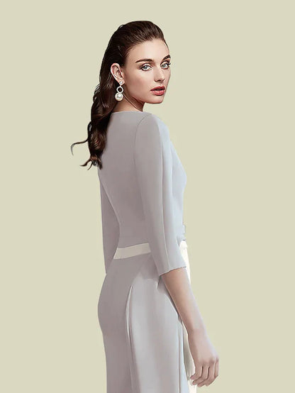 Close-up of the jewel neck and half sleeve on the satin dress.