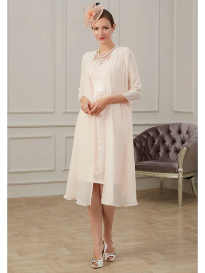 Woman wearing an elegant jewel neck, long sleeve, knee-length chiffon Mother of the Bride dress with appliques and ruching.