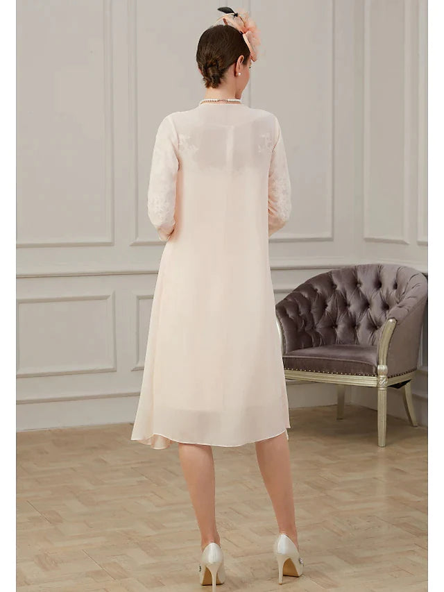 Side view of the elegant chiffon Mother of the Bride dress, highlighting long sleeves and ruching details.
