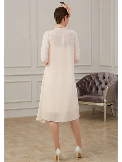 Side view of the elegant chiffon Mother of the Bride dress, highlighting long sleeves and ruching details.