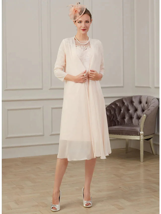 Back view of the elegant chiffon Mother of the Bride dress, showcasing its flowing design.