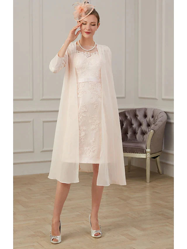 Full view of the elegant chiffon Mother of the Bride dress, showcasing its knee-length silhouette.